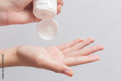 hands holding a cream