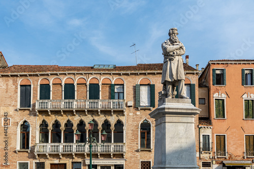 Campo Santo Stefano with historic buildings and the Monument to Niccolò Tommaseo in front  photo