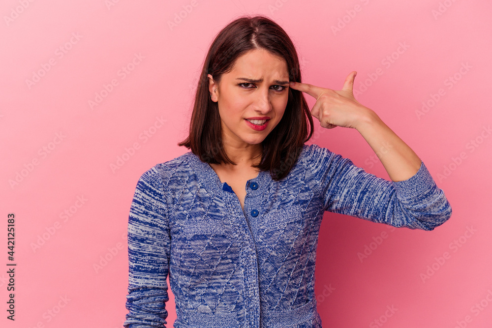 Young caucasian woman isolated on pink background showing a disappointment gesture with forefinger. Young caucasian woman isolated on pink background showing a disappointment gesture with forefinger.