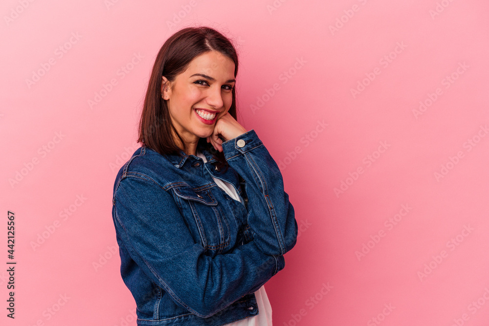 Young caucasian woman isolated on pink background smiling happy and confident, touching chin with hand. Young caucasian woman isolated on pink background smiling happy and confident, touching chin with hand.