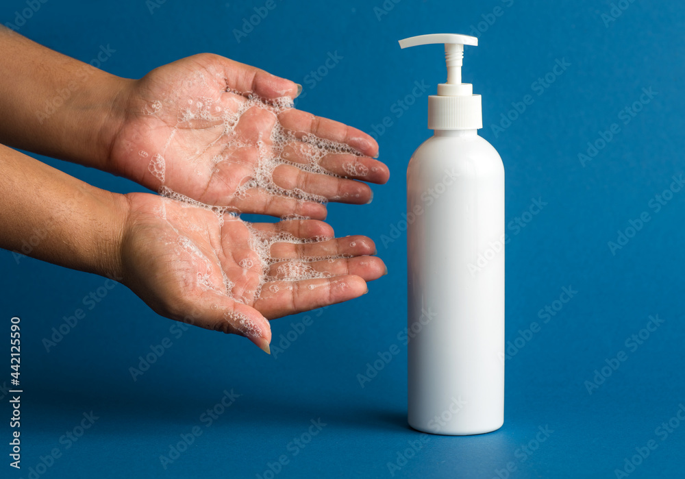 Closeup of person washing hands or using a sanitizing gel. Cleanliness and body care concept. Closeup of person washing hands or using a sanitizing gel. Cleanliness and body care concept.