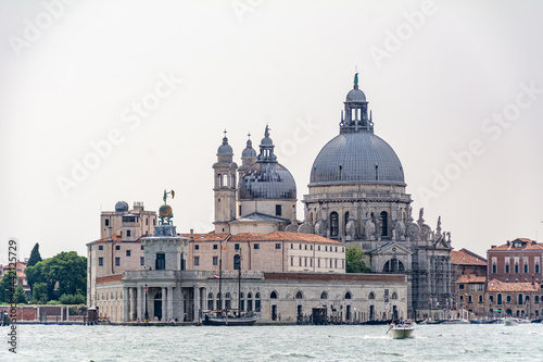 View of the "punta Della Dogana" warehouses and the "Santa Maria Della Salute" (Holy Mary of Health) Basilica in Venice, Italy