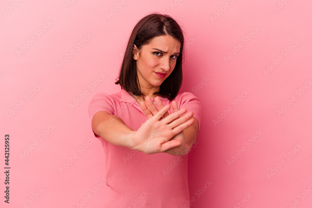 Young caucasian woman isolated on pink background doing a denial gesture Young caucasian woman isolated on pink background doing a denial gesture