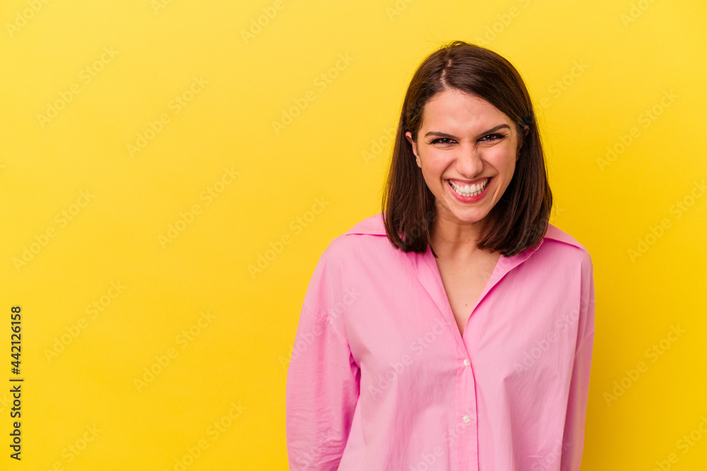 Young caucasian woman isolated on yellow background shouting very angry, rage concept, frustrated. Young caucasian woman isolated on yellow background shouting very angry, rage concept, frustrated.