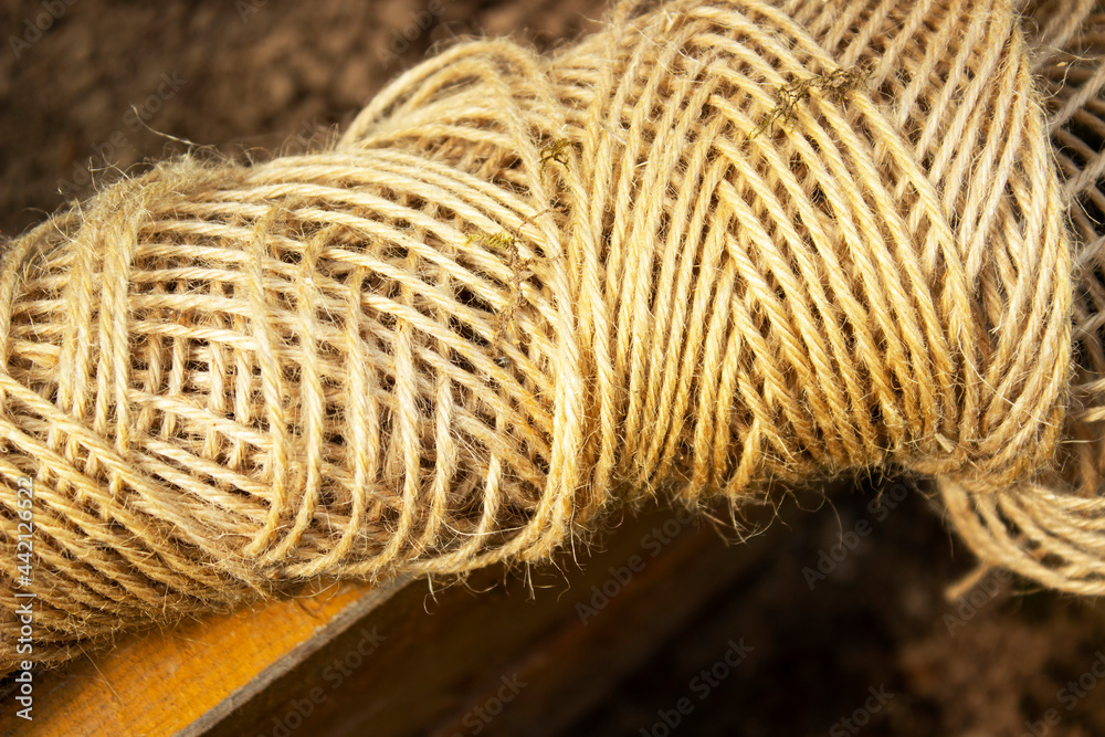 A ball of twine on a dark background