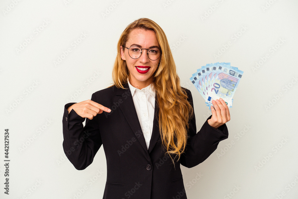 Caucasian business woman holding bills isolated on white background person pointing by hand to a shirt copy space, proud and confident Caucasian business woman holding bills isolated on white background person pointing by hand to a shirt copy space, proud and confident