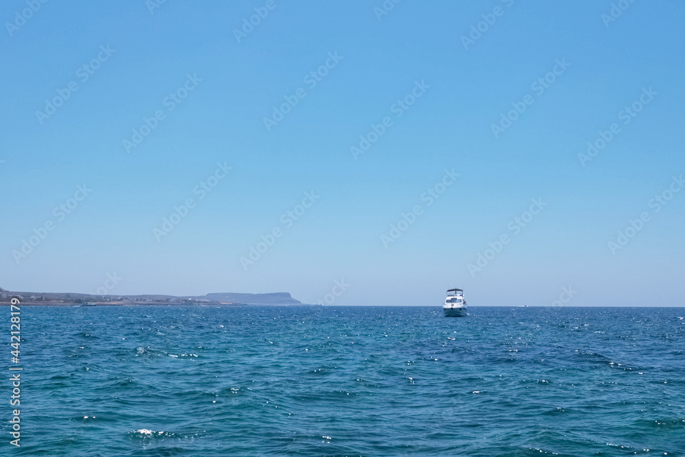 The coast of the Mediterranean Sea. The waves. The horizon. Sky and sea in summer