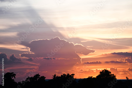 Evening sky sunset. big puffy cumulus and long stratus clouds. sky background with clouds