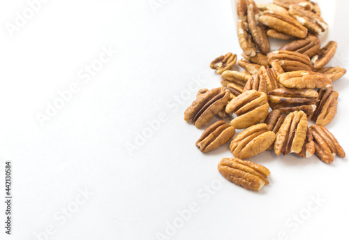 pecan nuts on white background. space for text