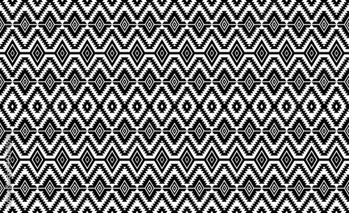 Seamless pattern repeating design with geometric shapes.