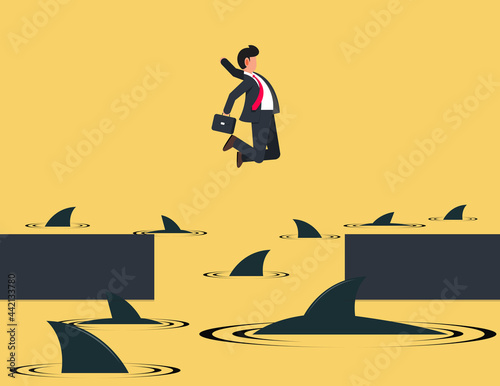 Businessman jumping over shark in water.  Concept financial crisis