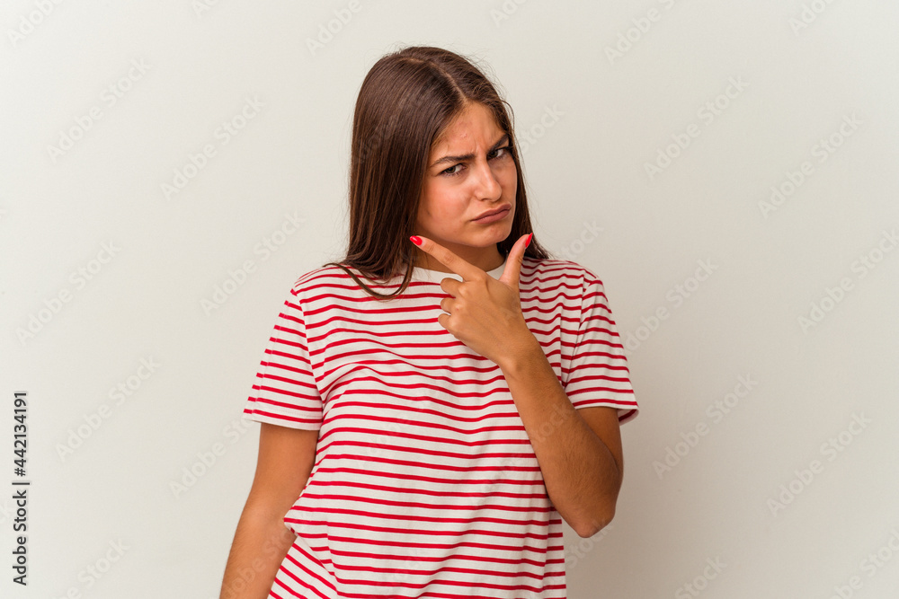Young caucasian woman isolated on white background having a strong teeth pain, molar ache. Young caucasian woman isolated on white background having a strong teeth pain, molar ache.