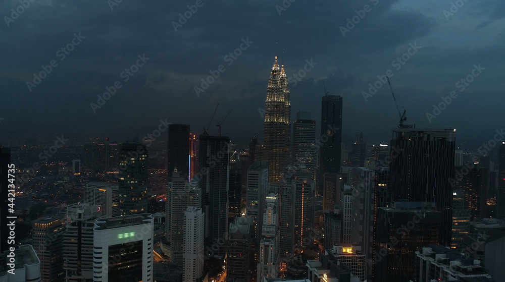 AERIAL. Cinematic view. Hight view to Kuala Lumpur city, Malaysia. Cityscape business skyscrapers night downtown.
