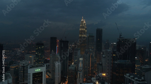 AERIAL. Cinematic view. Hight view to Kuala Lumpur city  Malaysia. Cityscape business skyscrapers night downtown.