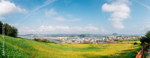 View of seaside village from Seongsan Ilchulbong Tuff Cone in Jeju Island, Korea
