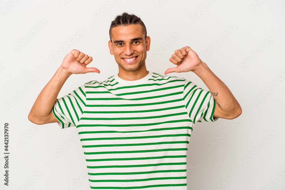 Young venezuelan man isolated on white background feels proud and self confident, example to follow. Young venezuelan man isolated on white background feels proud and self confident, example to follow.