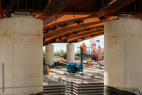 Fotografie Construction Workers working at height on a new bridge which is part of the Western Distributor Road in Preston, UK