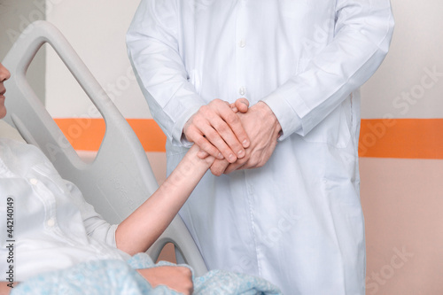 doctor hands reassuring her female patient. Medicine, help and health care concept.