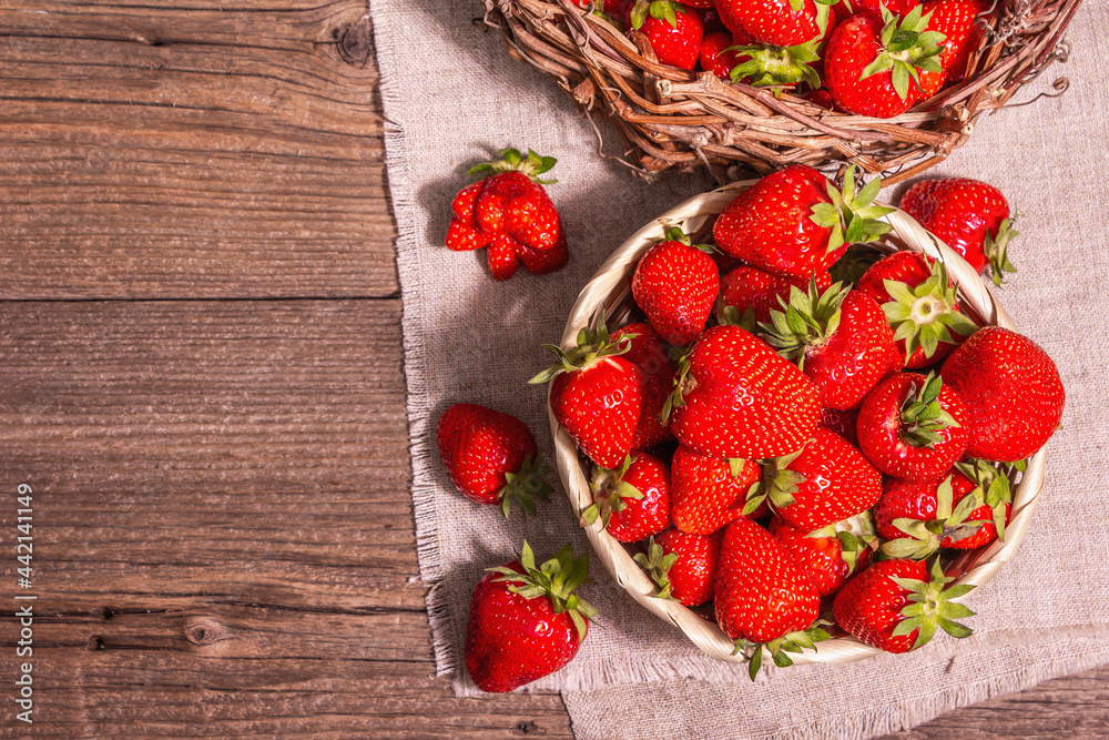Fresh ripe strawberry in a wicker basket