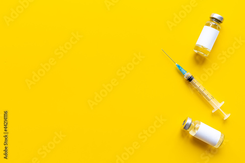 Vaccination concept. Vaccine vial dose with with syringe