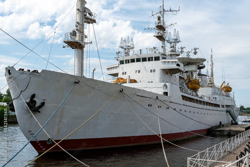 Naklejka premium KALININGRAD, RUSSIA-June 5, 2021 The space communication research vessel Cosmonaut Viktor Patsaev is moored on the Peter the Great Embankment in Kaliningrad.