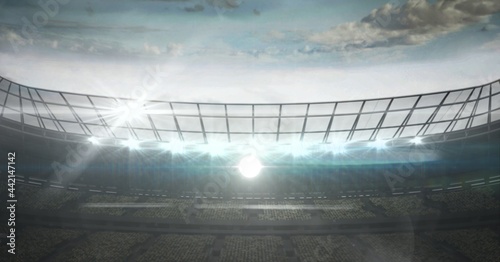 Composition of sports stadium with glowing spotlights and copy space