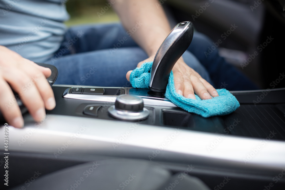 a man cleaning car interior car detailing concept selective focus