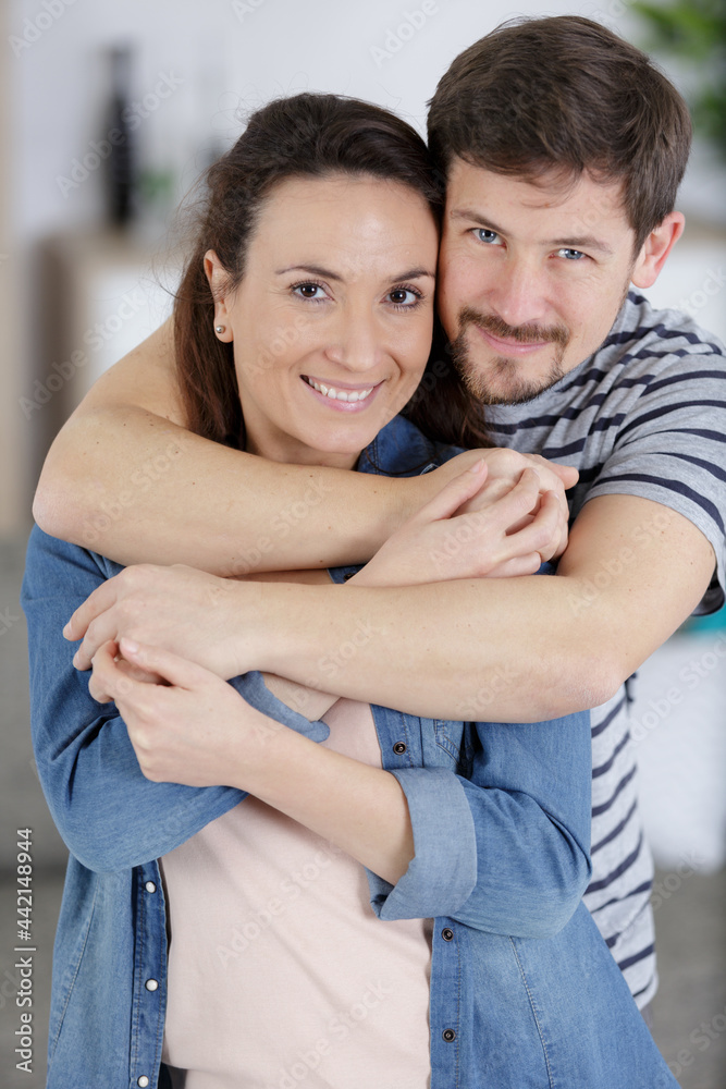 close up of a happy woman hugging her boyfriend close up of a happy woman hugging her boyfriend