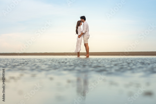 a young couple on the beach.