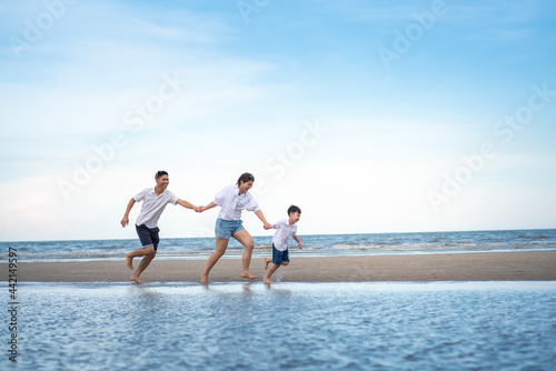 a happy family having fun on a beach