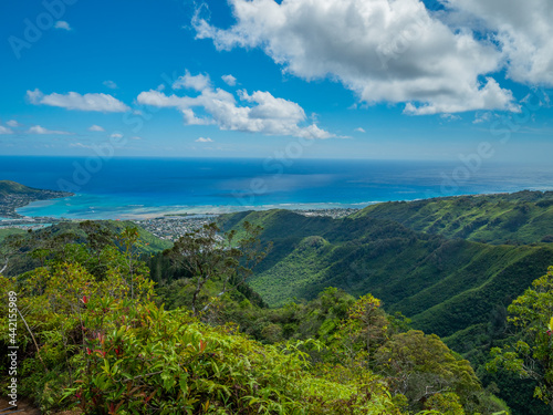 Blue sky over green mountains. Amazing view of the ocean. Kuliouou Ridge Trail, Hawaii, Oahu