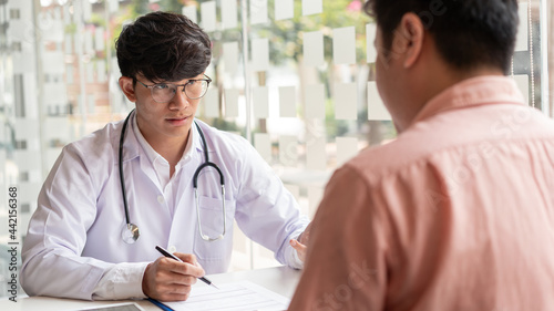Diagnose, A male patient listening a male doctor about diagnosis his symptoms after medical exam