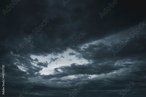 Light in the Dark and Dramatic Storm Clouds