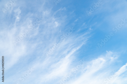 Summer Blue Sky and white cloud white background. Beautiful clear cloudy in sunlight spring season. vivid cyan cloudscape in nature environment. Outdoor horizon skyline with spring sunshine.