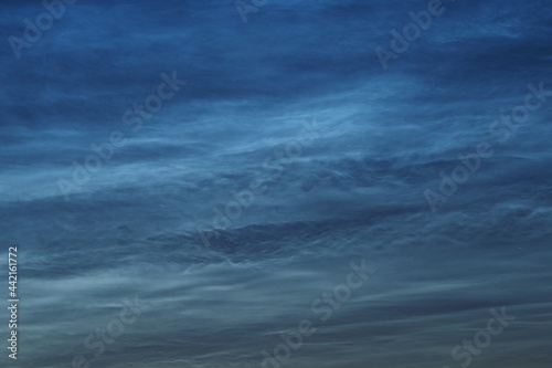 Noctilucent clouds in the night sky. Beautiful natural background. . High quality photo © Ольга Кожина