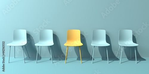 One out unique yellow chair concept with blue chairs photo