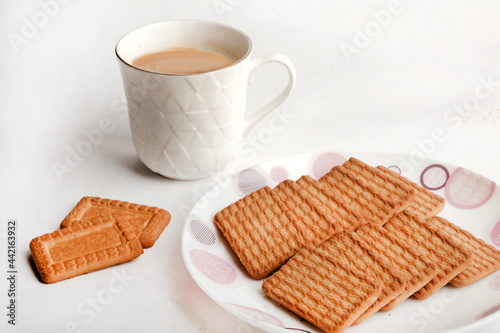 Wheat biscuits in the white plate, Atta biscuit, cookies - close up of a fresh breakfast cookies.