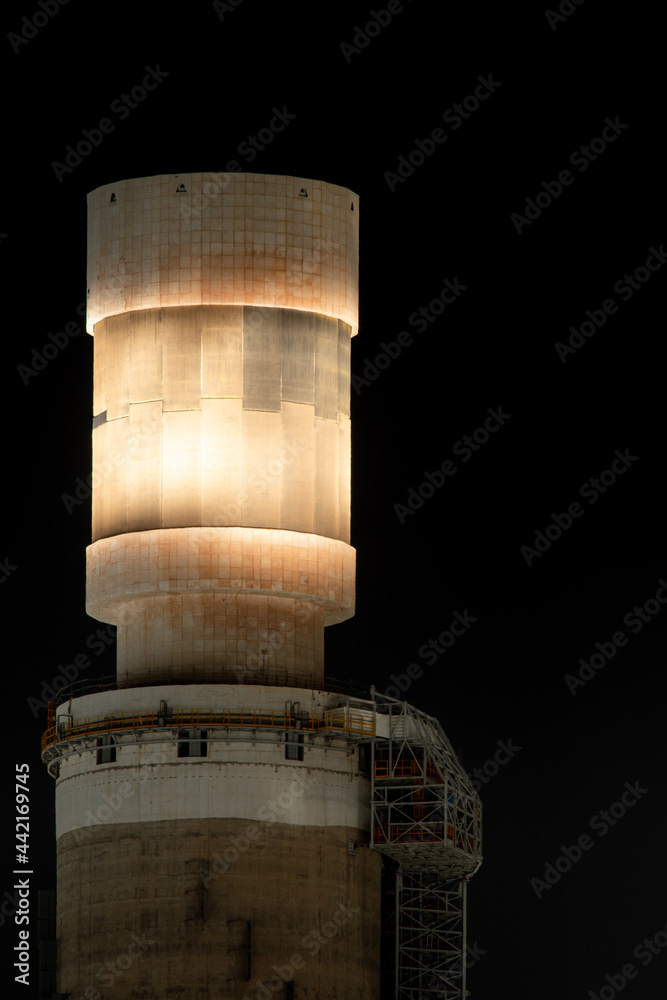 A top of a concentrated solar power tower on a black background.