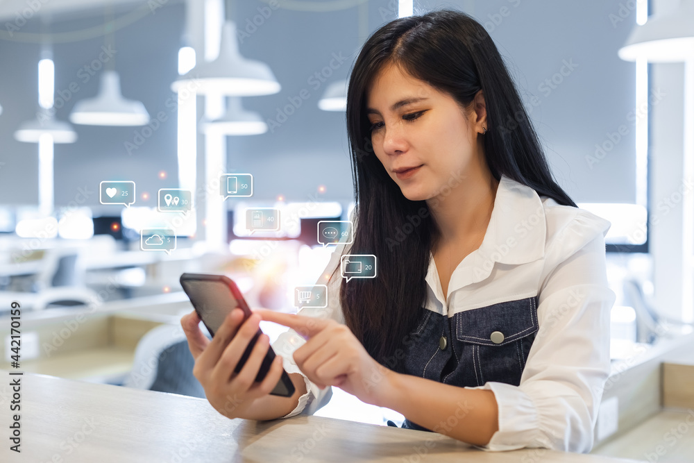 Asian, woman, using, smartphone with notification social media icons, woman using mobile phone, internet digital marketing concept. Asian, woman, using, smartphone with notification social media icons, woman using mobile phone, internet digital marketing concept.