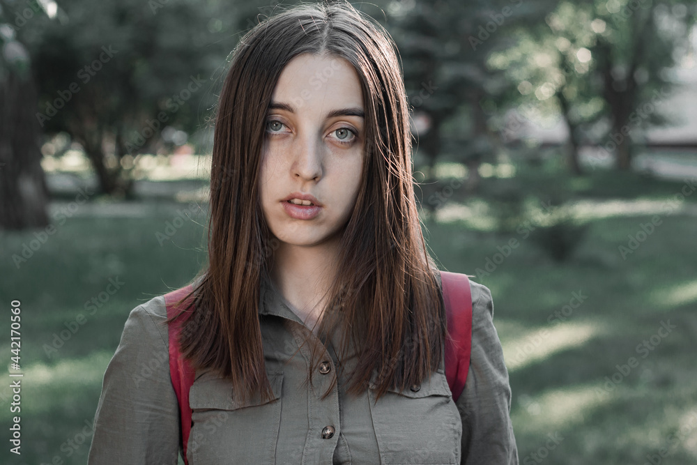 Portrait of a beautiful young woman in a summer park Portrait of a beautiful young woman in a summer park