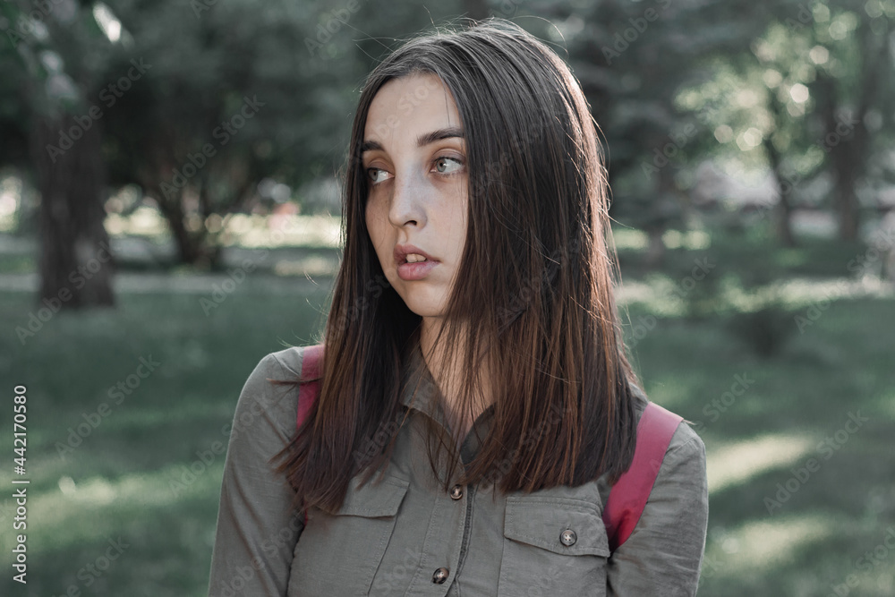 Portrait of a beautiful young woman in a summer park Portrait of a beautiful young woman in a summer park
