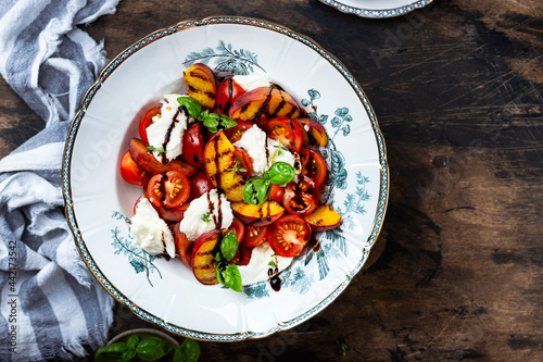 Grilled peach salad with mozzarella and tomatoes
