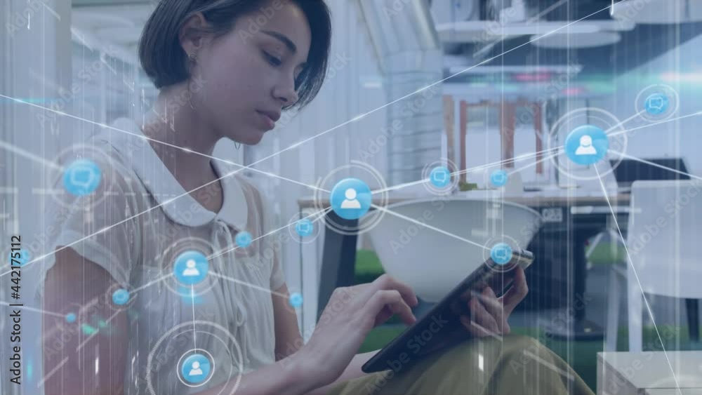 Animation of network of digital icons over woman using tablet Animation of network of digital icons over woman using tablet