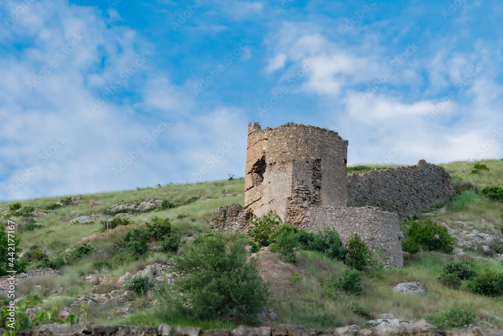 View tower of Chembalo fortress. Medieval architecture monument, landmark. Ruined stone Genoese fortress in Balaklava in Crimea	
