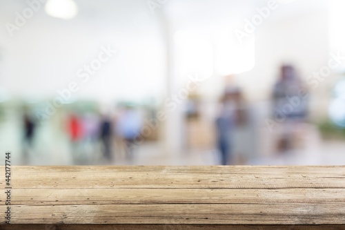 Empty wooden table top with blur room background,