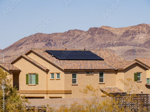 Sunny view of a two stories house with solar panel