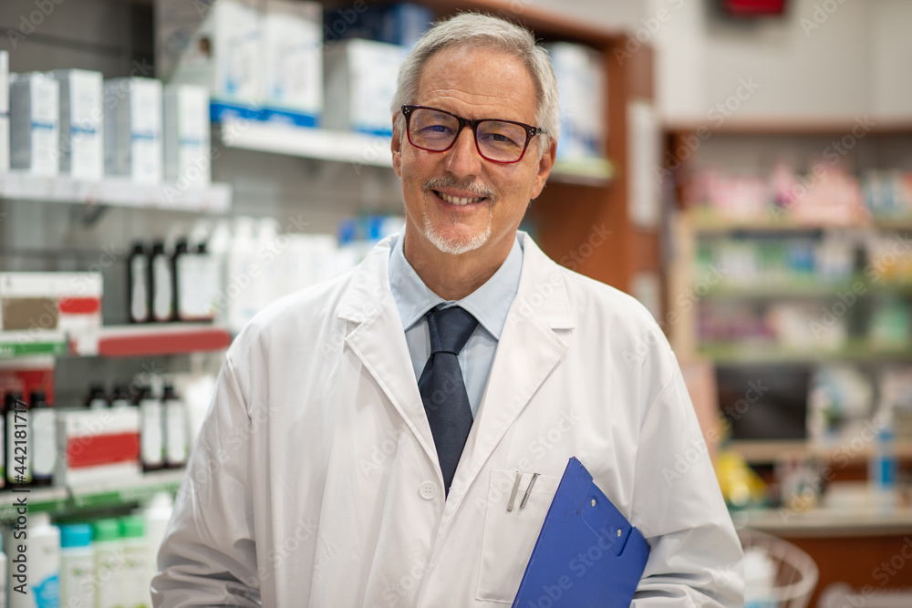 Pharmacist smiling in his shop Pharmacist smiling in his shop