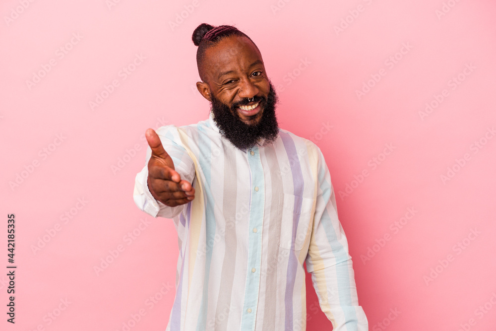 stretching hand at camera in greeting gesture. stretching hand at camera in greeting gesture.