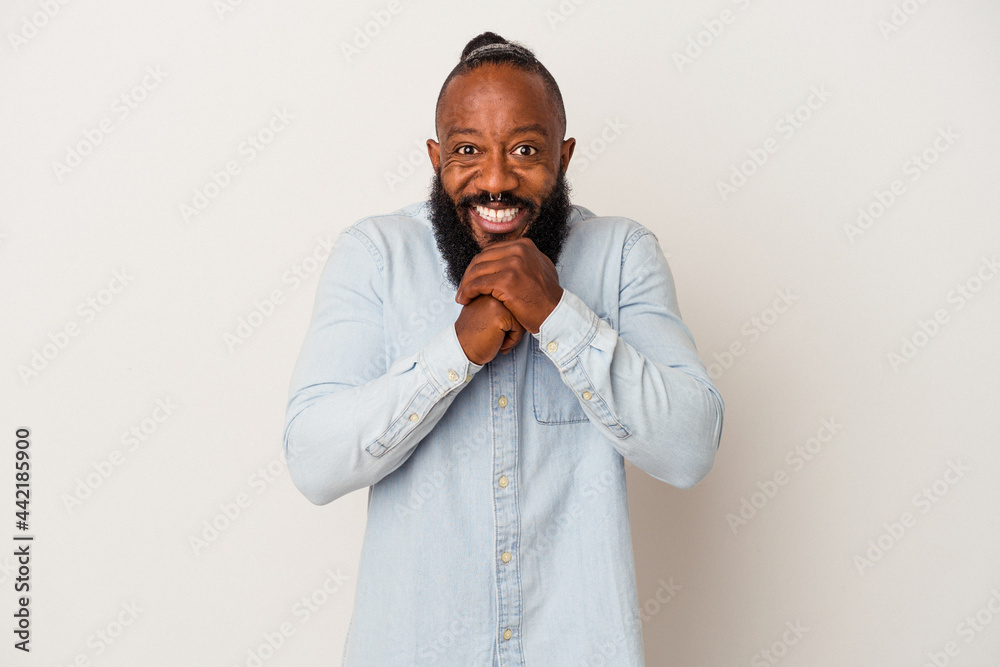 African american man with beard isolated on pink background praying for luck, amazed and opening mouth looking to front. African american man with beard isolated on pink background praying for luck, amazed and opening mouth looking to front.