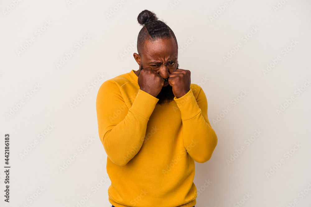 African american man with beard isolated on pink background throwing a punch, anger, fighting due to an argument, boxing. African american man with beard isolated on pink background throwing a punch, anger, fighting due to an argument, boxing.